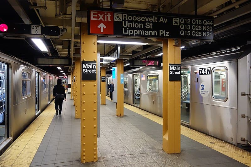 Main Street subway station platform with trains